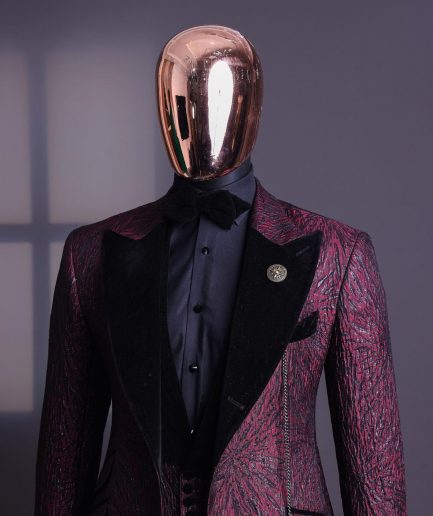 A burgundy, black broom splashed metallic jacquard, knitted, peak lapel tuxedo suit