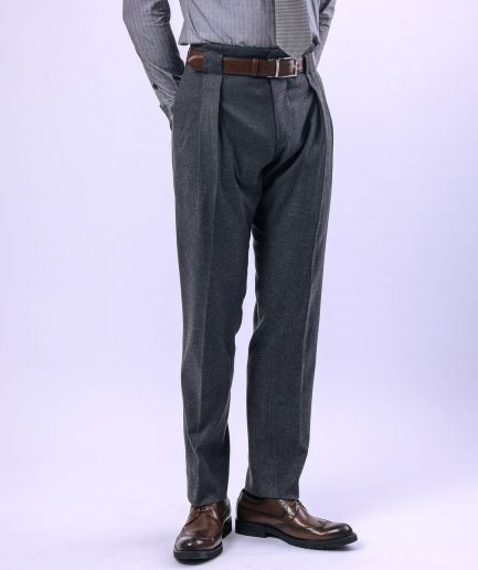 A Grey Gurkha pant with a covered belt tab and double pleats.