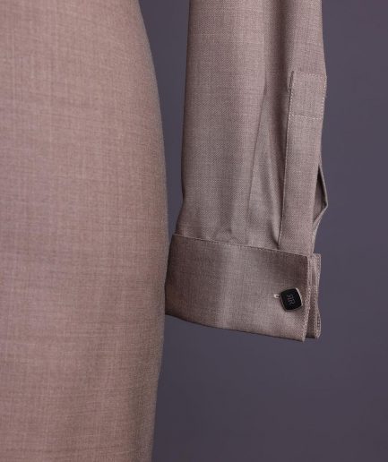 A Light brown, jorgecarli fabric, front flap with silver Swarovski button, long sleeve African senator kaftan native.