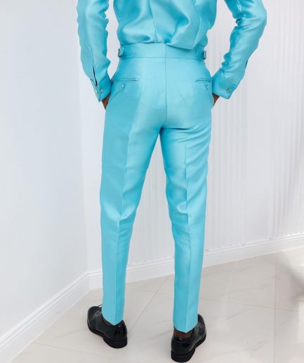 A Mikado Silk, turquoise blue, Gurkha pant with covered belt jab.