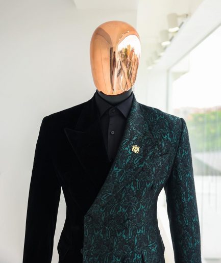 An Emerald green & black “rival” 1/4 cut ocean element peak lapel double breasted jacquard suit