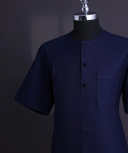 A Midnight blue, broken square pattern, Jorgecarli, front flap with black Swarovski button, 3/4 sleeve African senator Kaftan native.