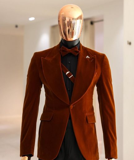 A Syrup Brown, Peak Lapel Tuxedo Suit With An Inner Slant Anchor.