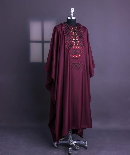 A Burgundy, Connected Ring With Gold Eyelet Details Agbada