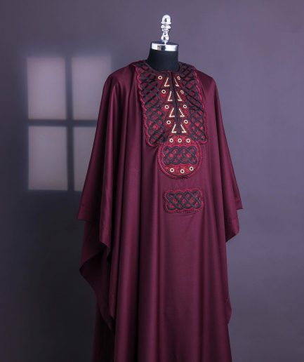 A Burgundy, Connected Ring With Gold Eyelet Details Agbada