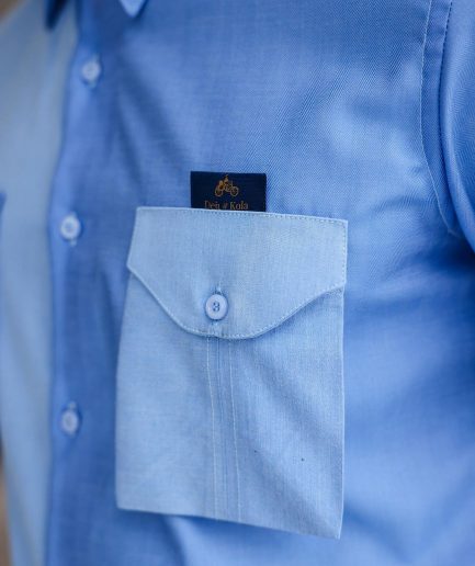 A Herringbone mix shade of blue English spread collar short sleeve casual shirt with double patch pocket.