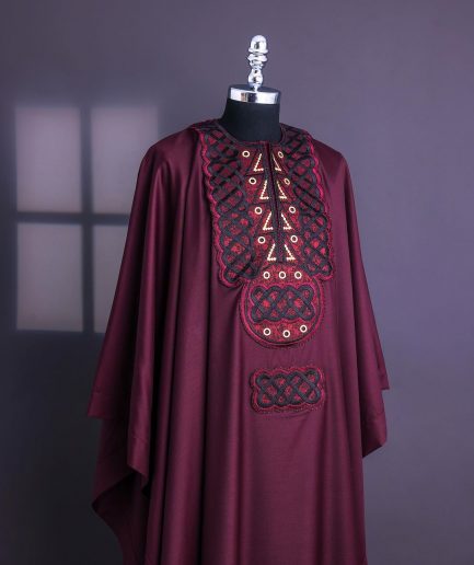A Burgundy, Connected Ring With Gold Eyelet Details Agbada