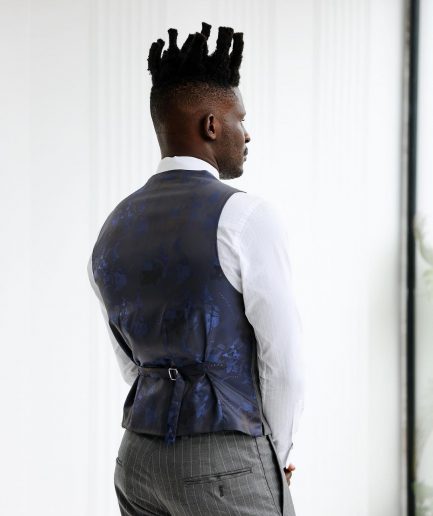 A Grey and ivory white pencil stripe, double-breasted shawl lapel waistcoat.