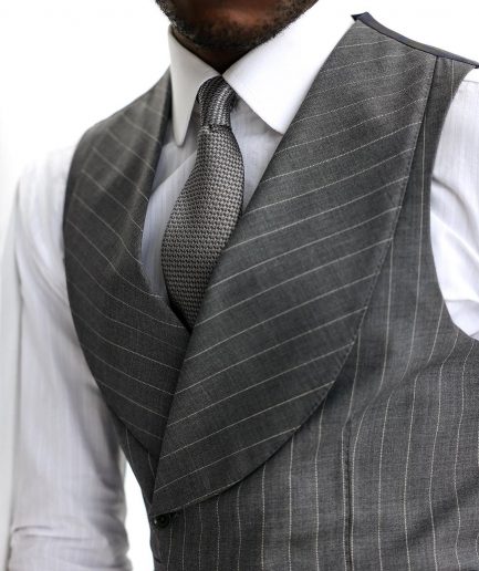 A Grey and ivory white pencil stripe, double-breasted shawl lapel waistcoat.