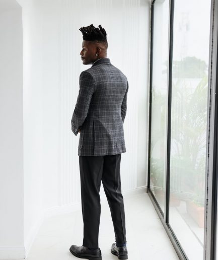 A Charcoal grey, windowpane check, nobility fabric cover coat with patch pocket detailing