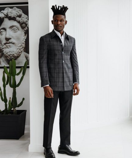 A Charcoal grey, windowpane check, nobility fabric cover coat with patch pocket detailing