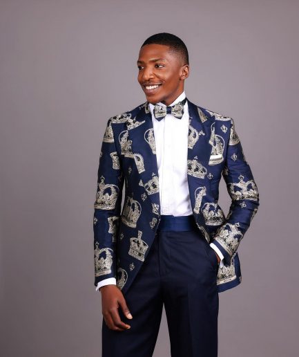 A Navy Blue Peak Lapel, Dispersed Crown Metallic Jacquard Tuxedo Suit And Wide Cut Pant Trouser.