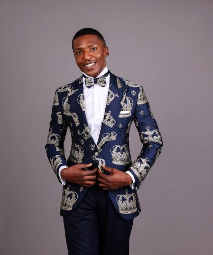 A Navy Blue Peak Lapel, Dispersed Crown Metallic Jacquard Tuxedo Suit And Wide Cut Pant Trouser.