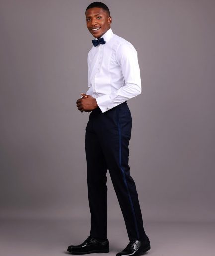 A White, Tuxedo Shirt With Dotted Front Details.