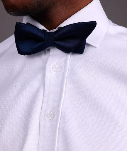 A White, Tuxedo Shirt With Dotted Front Details.
