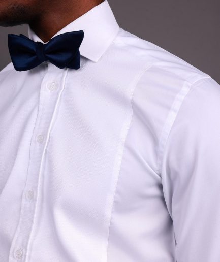 A White, Tuxedo Shirt With Dotted Front Details.