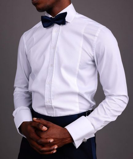A White, Tuxedo Shirt With Dotted Front Details.