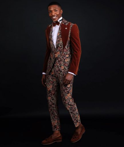 A “Dent” Floral Syrup Brown Metallic Jacquard Peak Quad Lapel Suit, Bow Tie & Gurkha Pant Trousers.