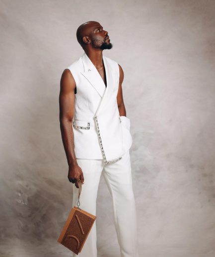 An Ivory White Monochrome “Jilted” Trio Lapel Armless Jacket With Swarovski Crystal Stone Details