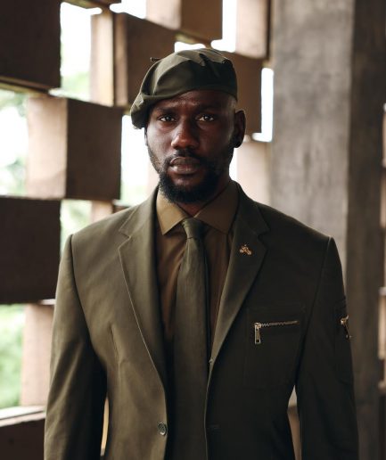 An Army Green Monochrome “Junta” Notch Lapel Suit With Patch Pocket Zip Detailing & Gurkha Pant Trousers.