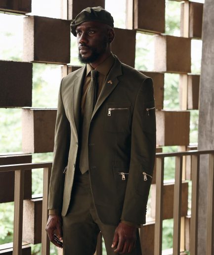 An Army Green Monochrome “Junta” Notch Lapel Suit With Patch Pocket Zip Detailing & Gurkha Pant Trousers.