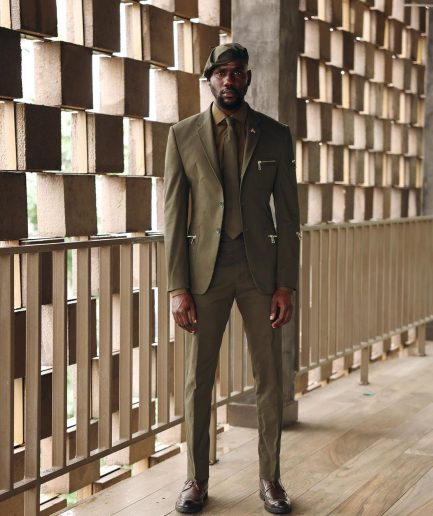 An Army Green Monochrome “Junta” Notch Lapel Suit With Patch Pocket Zip Detailing & Gurkha Pant Trousers.