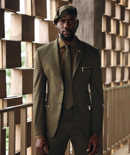 An Army Green Monochrome “Junta” Notch Lapel Suit With Patch Pocket Zip Detailing & Gurkha Pant Trousers.