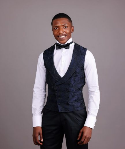 A Double-Breasted, Curved Peak Lapel Waistcoat.