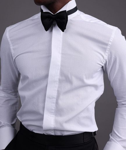 A White, covered button, connected paisley print wing collar tuxedo shirt.