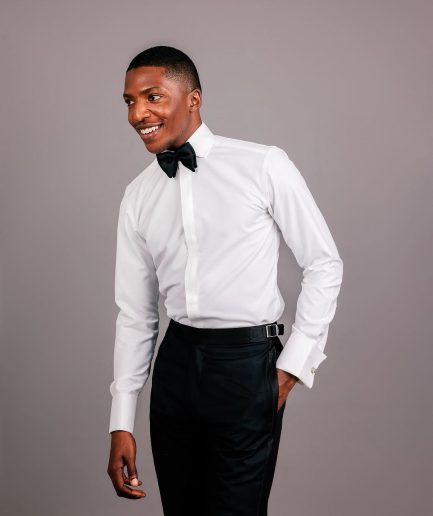 An Ivory white, covered button flap, tuxedo shirt.