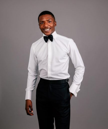An Ivory white, covered button flap, tuxedo shirt.