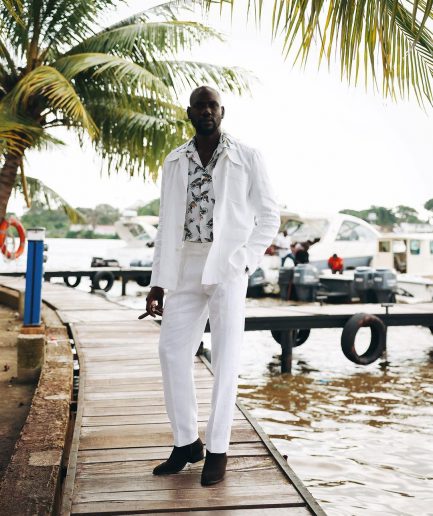 A White “Tropicana” Linen Overcoat & Wide Cut Pant Trousers.