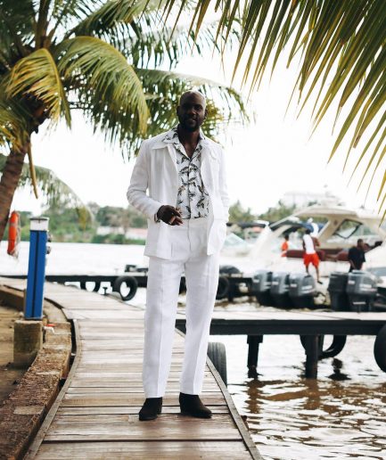 A White “Tropicana” Linen Overcoat & Wide Cut Pant Trousers.