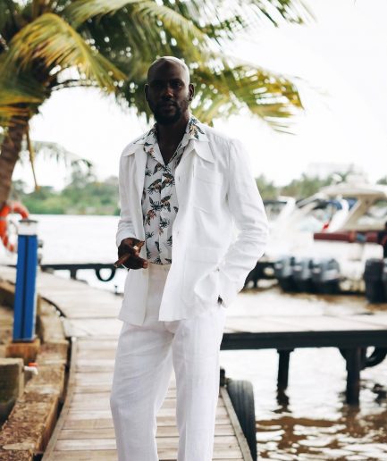 A White “Tropicana” Linen Overcoat & Wide Cut Pant Trousers.