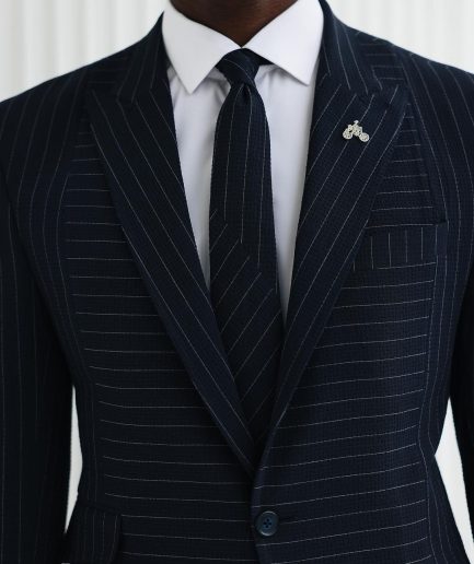 A Navy Blue, Seersucker, Reversed Pin Stripe Peak Lapel Suit