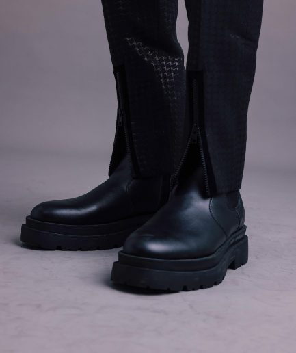 A Charcoal Black, Stuffed/Slanted Square-Patterned Jacquard pant with zip-line detailing