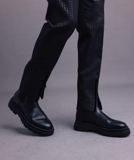A Charcoal Black, Stuffed/Slanted Square-Patterned Jacquard pant with zip-line detailing