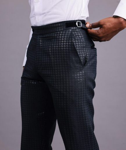 A Charcoal Black, Stuffed/Slanted Square-Patterned Jacquard pant with zip-line detailing