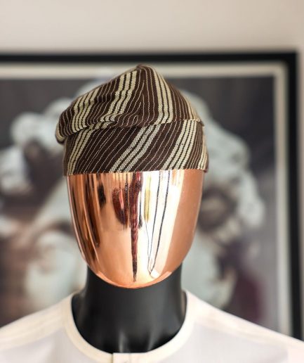 An umber brown Yoruba traditional African hat or fila