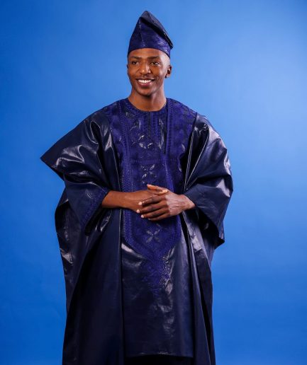 A Navy blue "Arewa" embroidery front cut towards back, traditional Agbada, 3/4 sleeve kaftan, and Sokoto