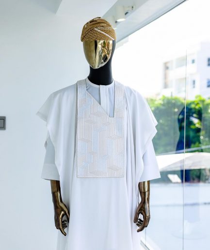A White, dropping maze line embroidery details agbada, 3/4 sleeve kaftan, and Sokoto