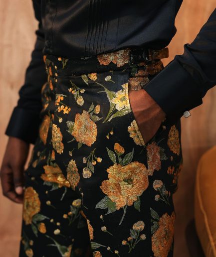 A yellow, silk black jacquard pants with a splash of gold print.