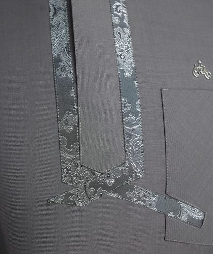 A Grey, matching slanted paisley, front flap, 3/4-sleeve African senator kaftan native.