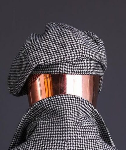 A Light Grey And Black Mix Of Houndstooth Check Hat.