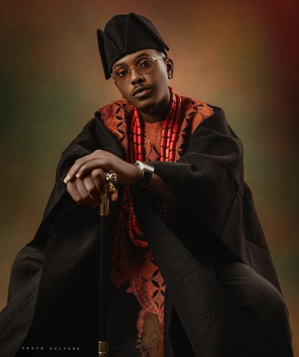 A Charcoal black, Arewa embroidery, front cut towards the back, traditional Agbada