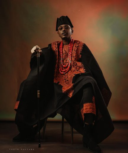 A Charcoal black, Arewa embroidery, front cut towards the back, traditional Agbada