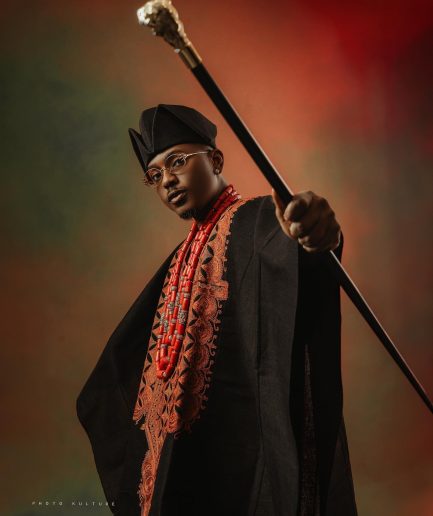 A Charcoal black, Arewa embroidery, front cut towards the back, traditional Agbada
