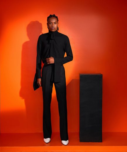 A black, covered neck shirt.