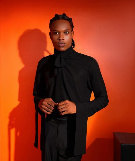 A black, covered neck shirt.
