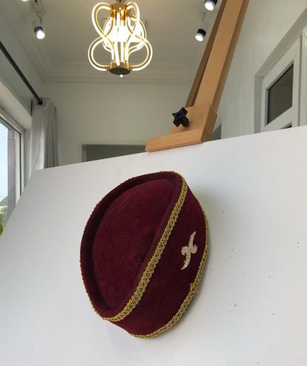 A Burgundy and Gold Ceremonial African Traditional Hat